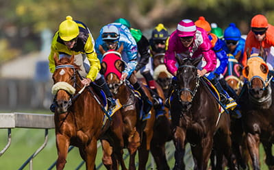 Horses running at a modern Dubai Future Champions Festival race