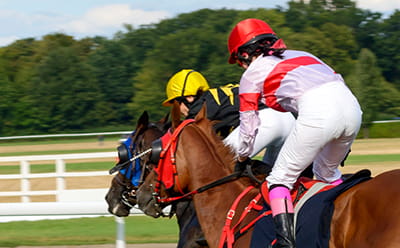 A modern race at Nottingham Racecourse with two horses running