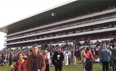 Crowds of people on the Ascot Racetrack turf