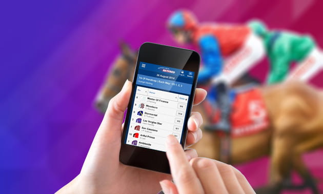 Running horses with the Betfred mobile betting app overlayed