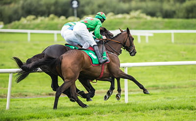 A modern Guineas Festival race with horses running