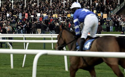 Newcastle all-weather historic racecourse, with a jockey in the foreground 