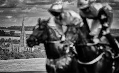 A vintage painting of Salisbury Racecourse in black and white. Two riders racing, with the cathedral in the background.
