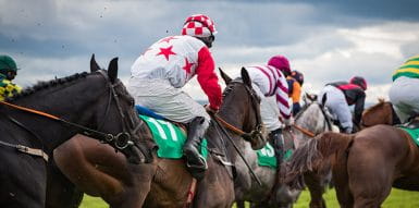 Jockeys riding a horse